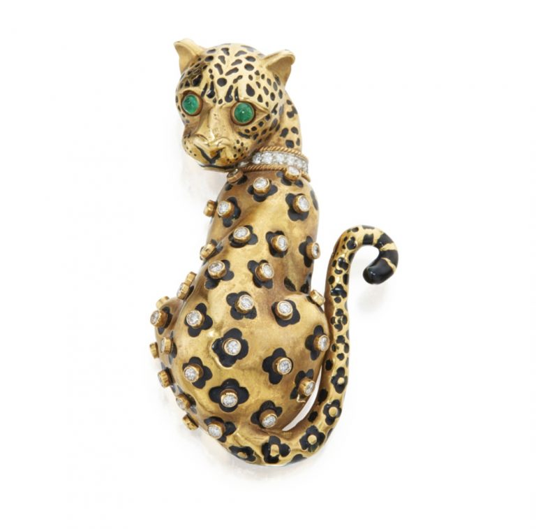 Gold, Enamel, Diamond and Emerald Clip-Brooch, David Webb Designed as a leopard, the spots applied with black enamel and accented with bezel-set round diamonds, the eyes set with cabochon emeralds