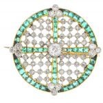 An Edwardian diamond and emerald brooch