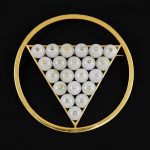 A Jade and Diamond Brooch / Pendant. 14 karat yellow gold round brooch / pendant contains 21 jade beads, each containing a gold bezel with one diamond inside within a triangular mounting. Reverse bears a pin closure and double bail for use as a pendant Diameter: 3" Wt: 59.7 grams