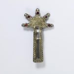 Merovingian brooch, silver-gilt, decorated with niello and set with garnets over patterned foil.