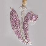 AN 18CT WHITE GOLD SCOTTISH THISTLE STYLE BROOCH set with diamonds, pink sapphires and lemon citrines.