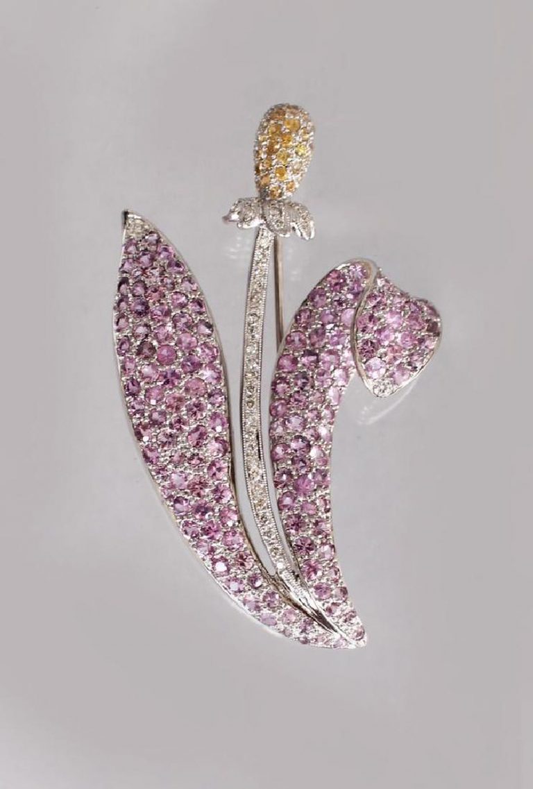 AN 18CT WHITE GOLD SCOTTISH THISTLE STYLE BROOCH set with diamonds, pink sapphires and lemon citrines.