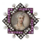 An Antique ruby, seed pearl and diamond portrait brooch