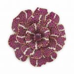 AN ELEGANT RUBY AND DIAMOND 'CAMELLIA' BROOCH, BY CHANEL