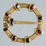 Annular brooch; gold, ruby, sapphire