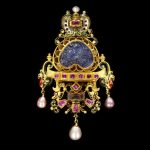 Jewelled pendant brooch with enamelled gold and a large sapphire intaglio of a battle scene