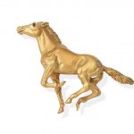 A novelty brooch, by Tiffany Modelled as a galloping horse