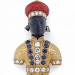 A DIAMOND, SAPPHIRE, CORAL AND GOLD FIGURAL BROOCH BY NARDI