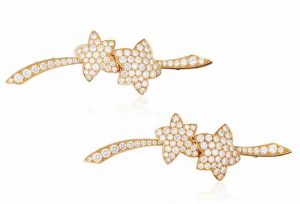 VAN CLEEF & ARPELS PAIR OF DIAMOND STAR BROOCHES